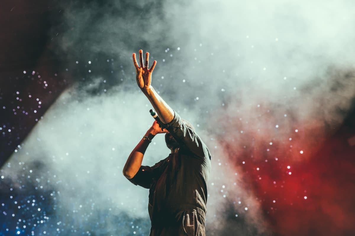A disc jockey mixing on turntables at a live event